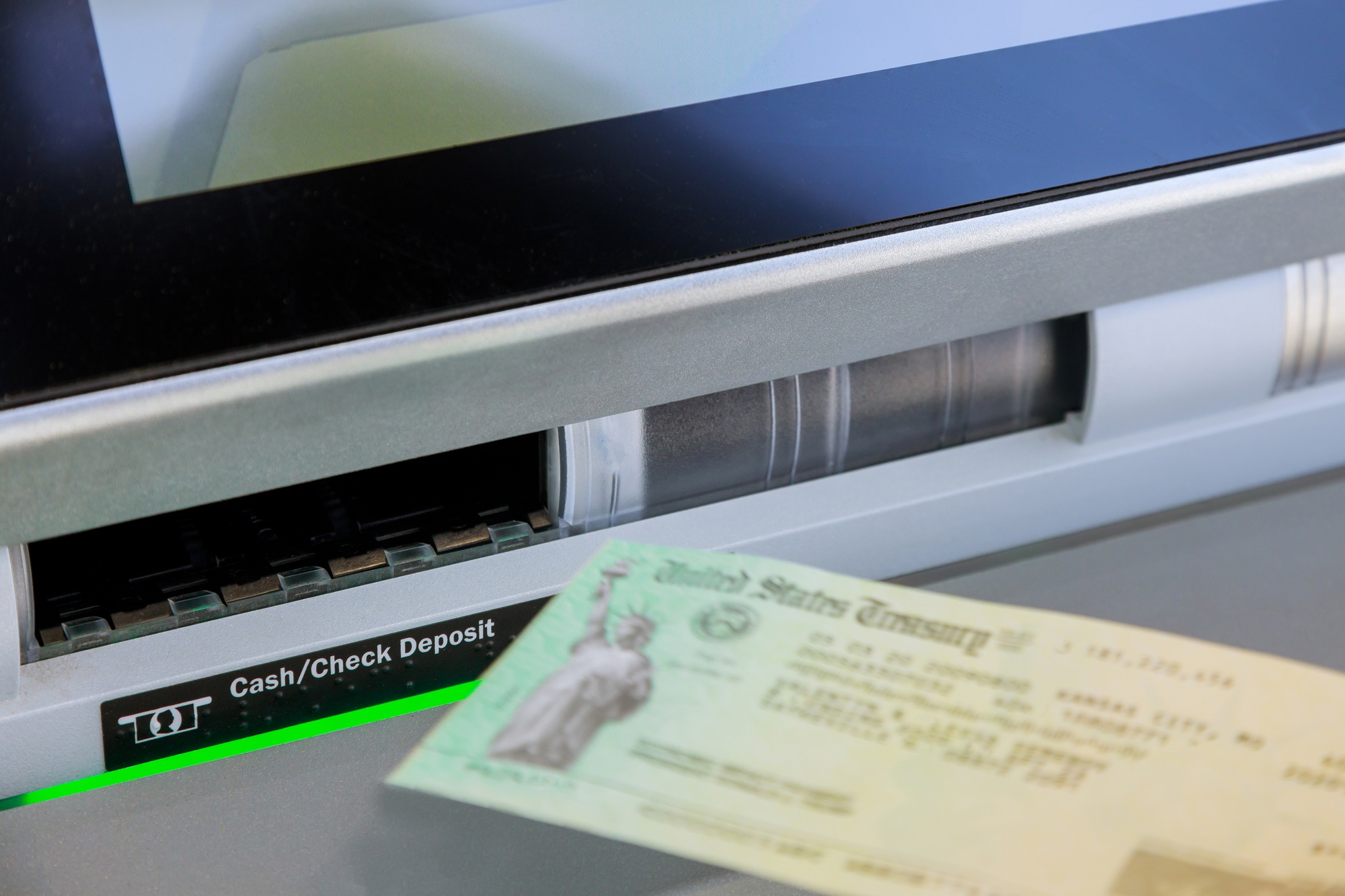 Entering stimulus deposit check to banking using on ATM on machine transfer